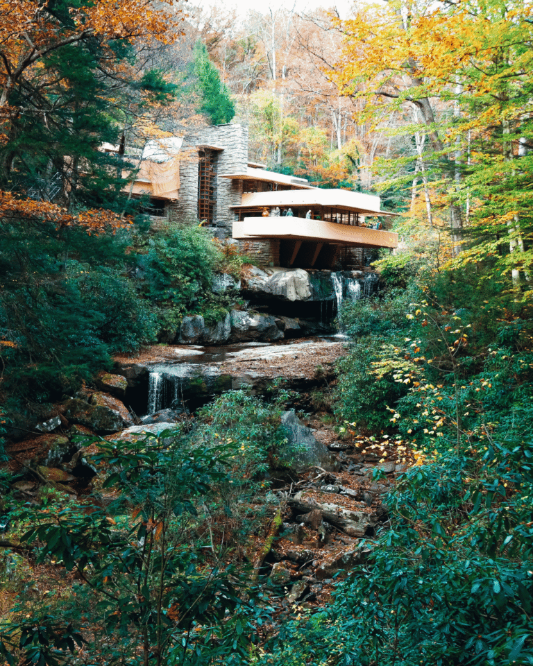 Frank Lloyd Wright's Fallingwater house built over a waterfall in Mill Run, Pennsylvania, surrounded by autumn foliage