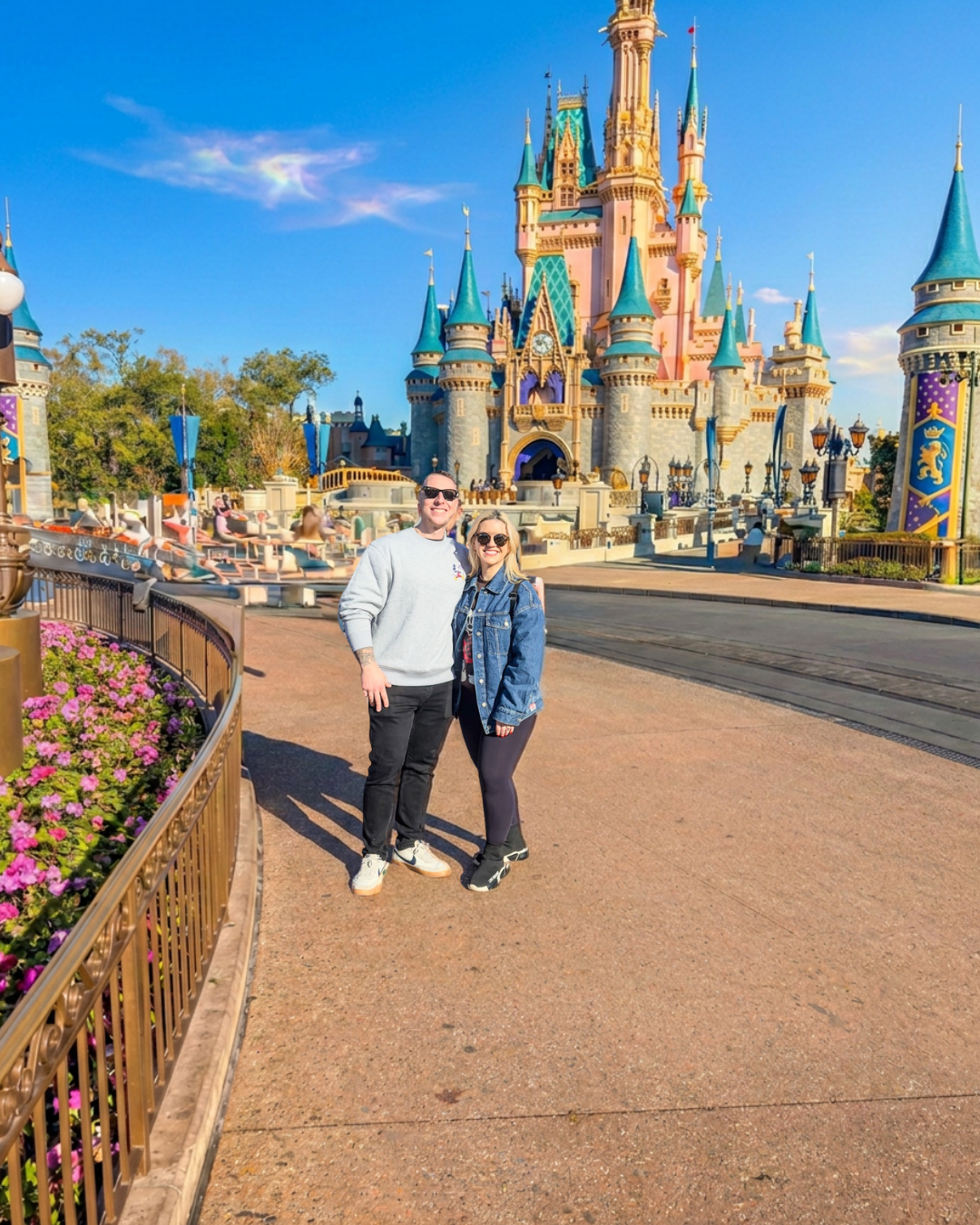 Courtney and Nick in front of Cinderella Castle at Magic Kingdom during their one-day Disney World trip from Pittsburgh